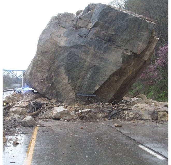 boulder blocking the road